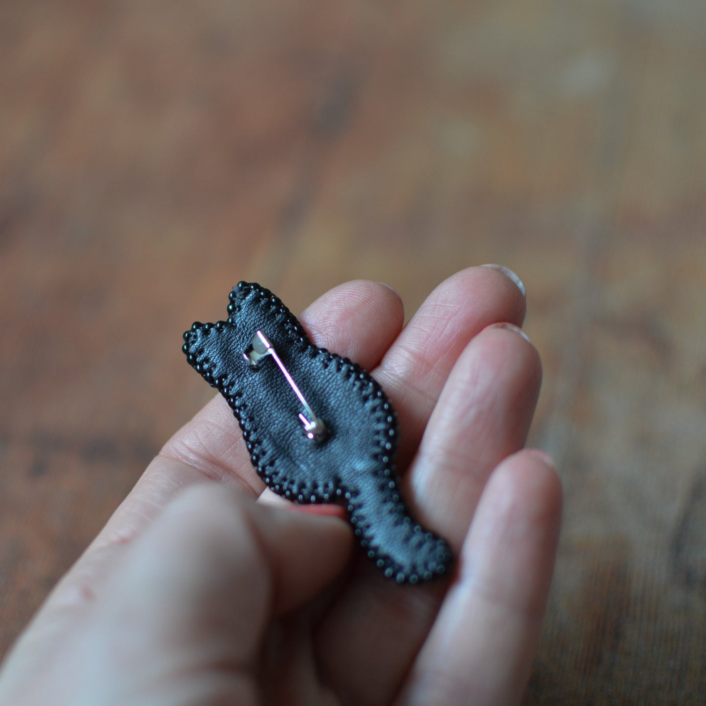 Embroidered black cat silhouette brooch  - back