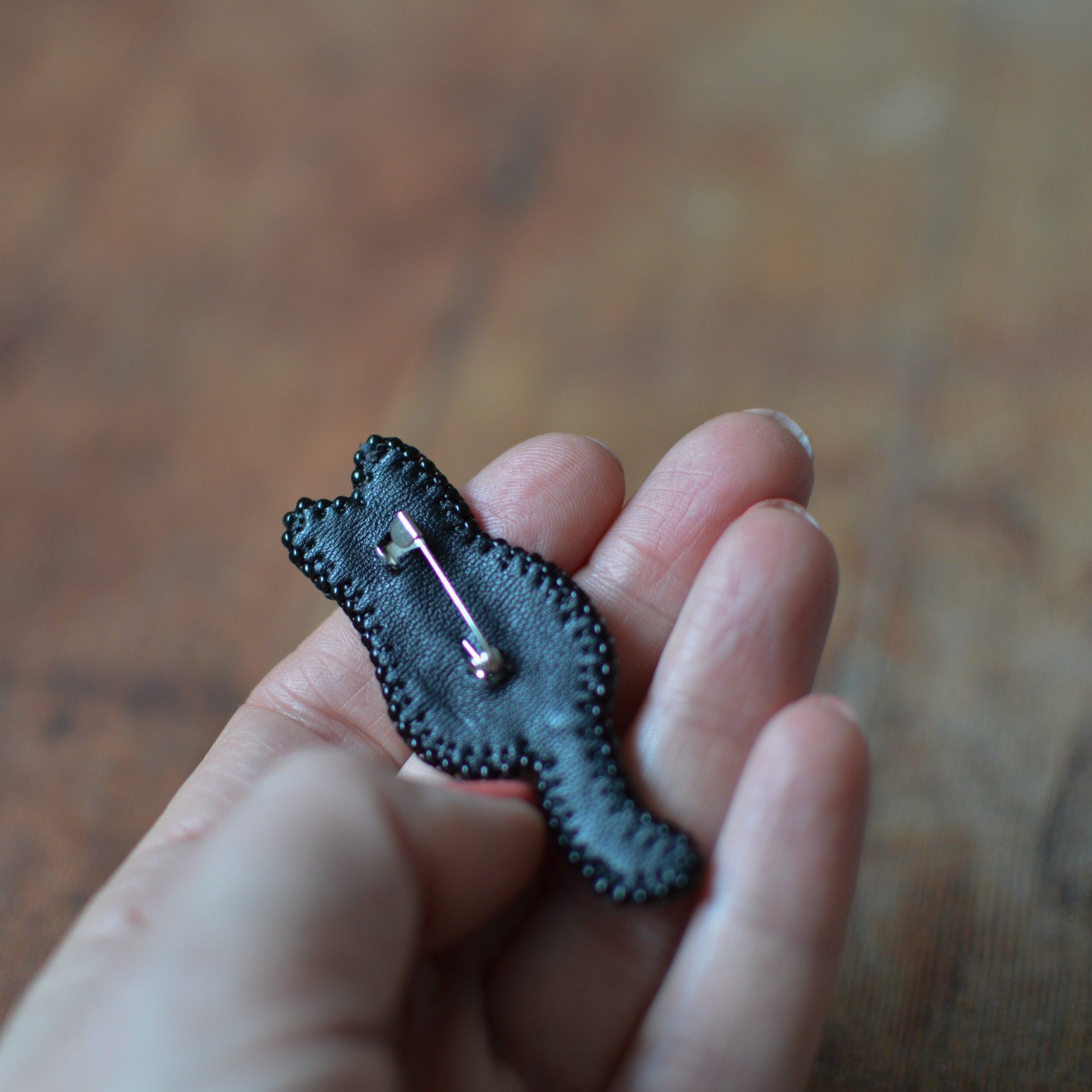 Embroidered black cat silhouette brooch  - back