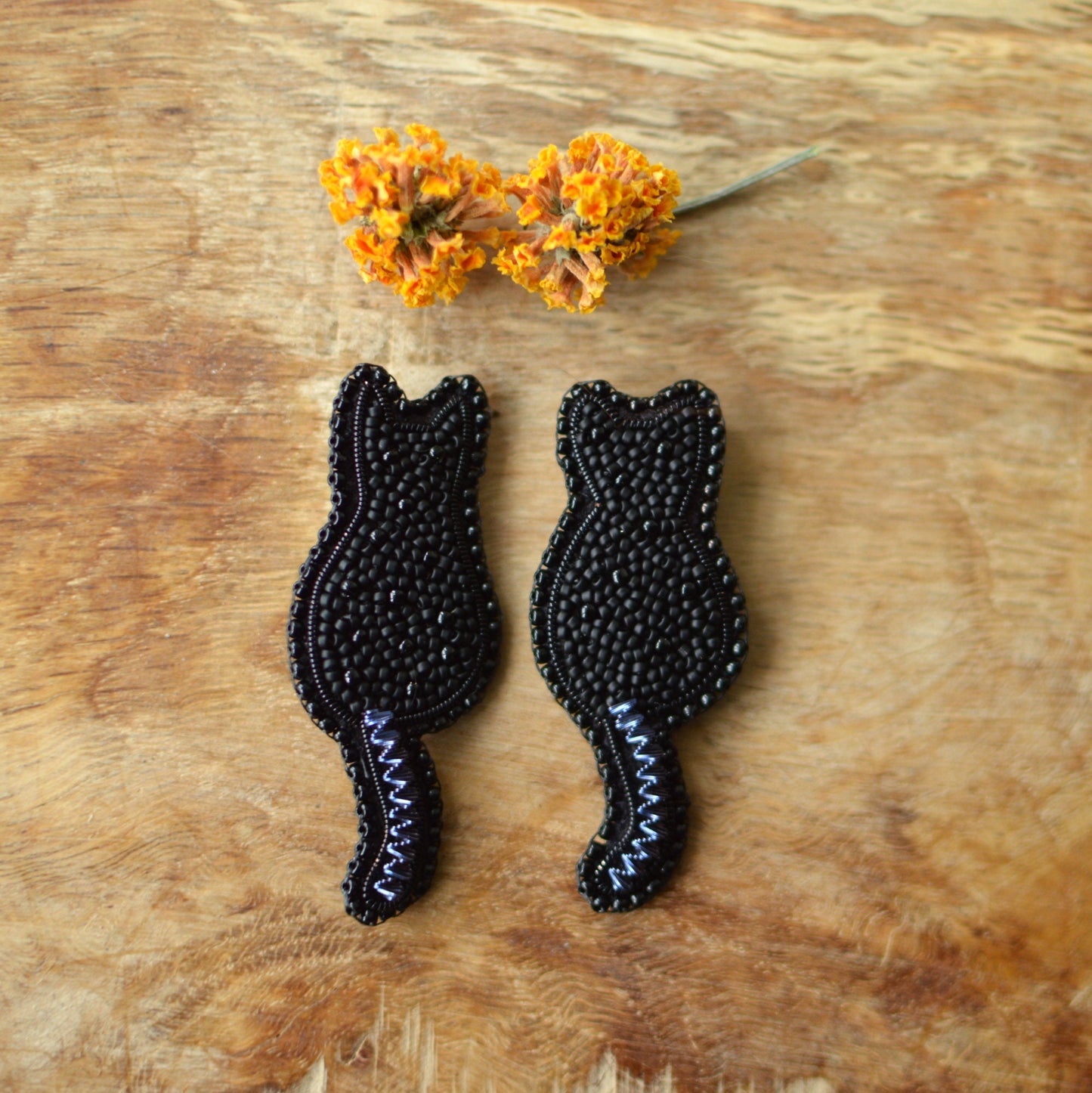 Two Embroidered black cat silhouette brooch es