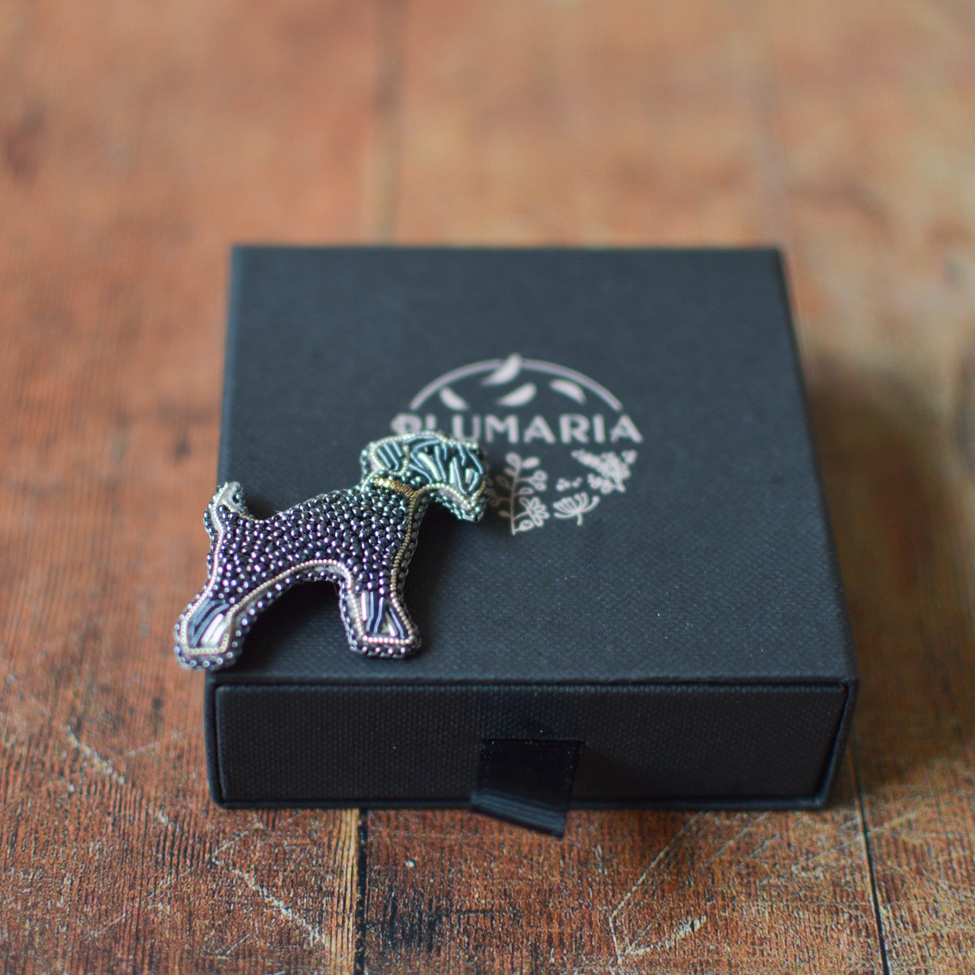 Black Schnauzer Brooch and Plumaria's packaging