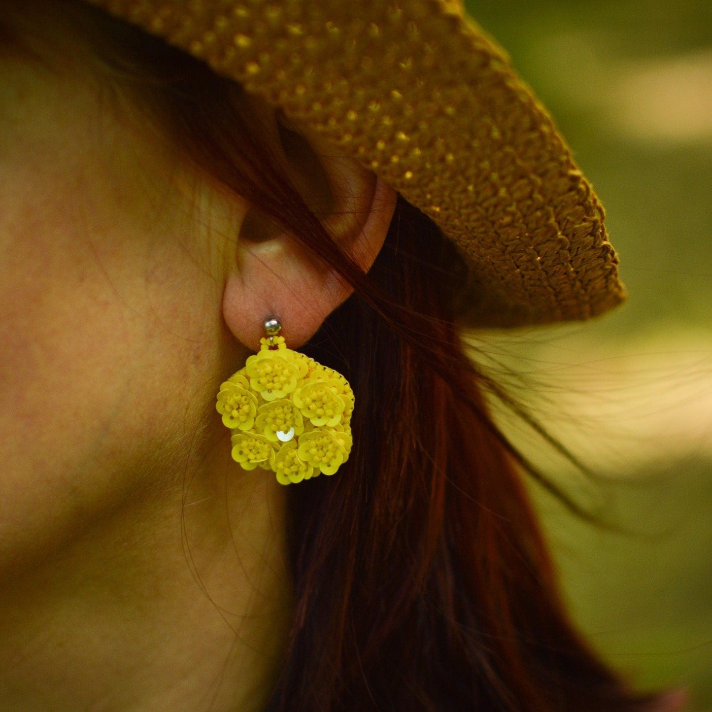 Floral Sequin Earrings - Yellow on a model